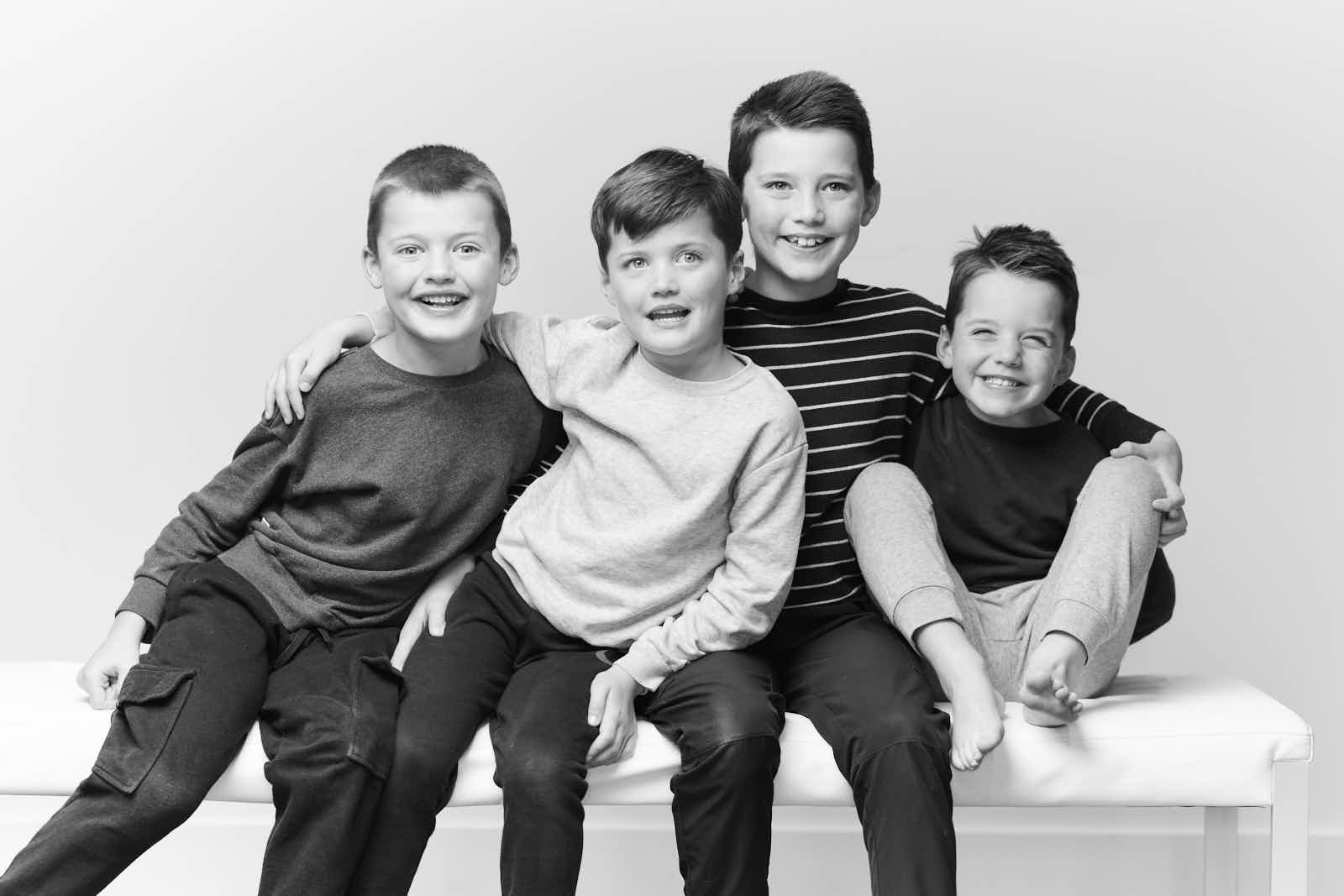 Four boys, one bench, zero serious faces