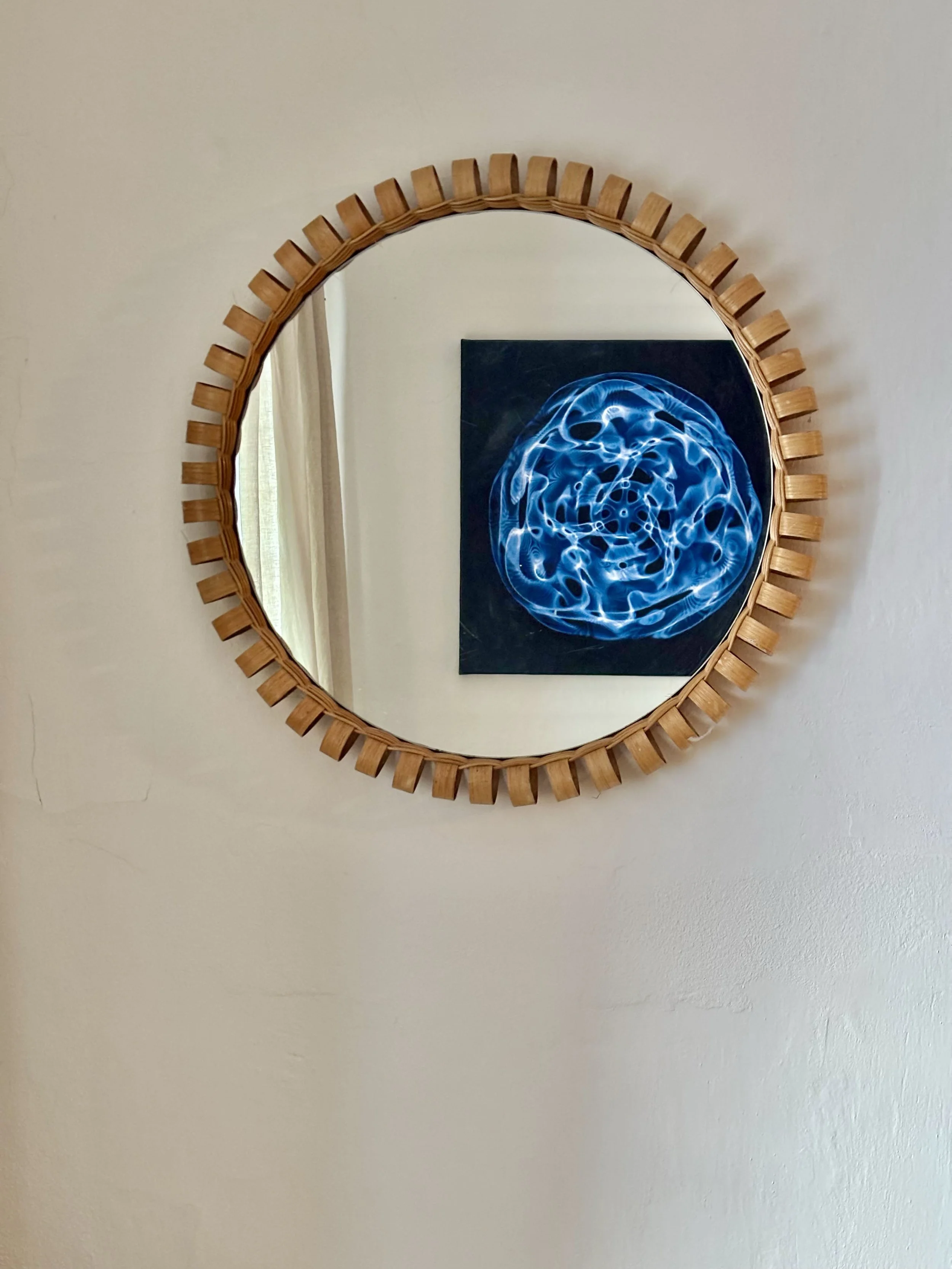 a mirror reflects a voice mandala