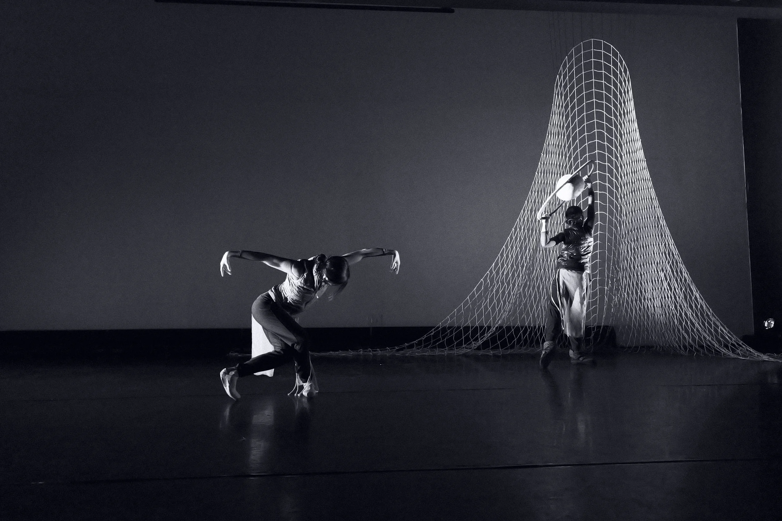artists Cassandra Punzo and Dominique Jenssen perform Tidal Passage - photo by Preston Light - sets and costumes by Karen Lee Williams - lighting by Saúl Ulerio