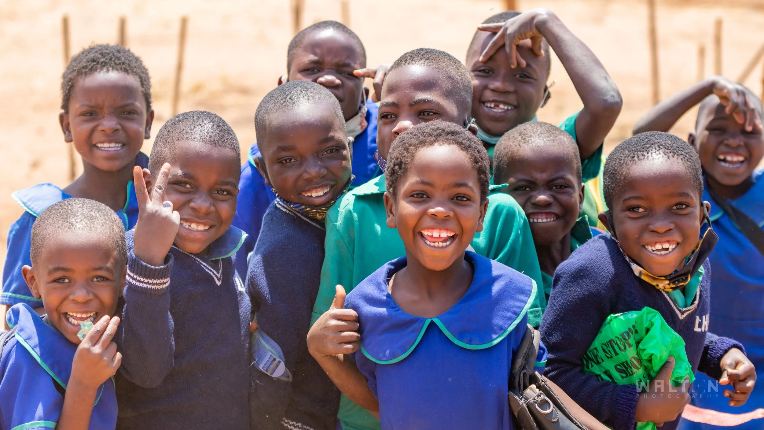 a group of school kids smiling