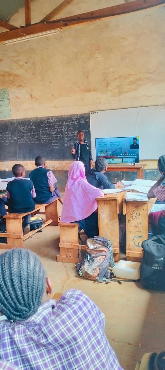 image of a young girl leading a classroom of students in a lesson