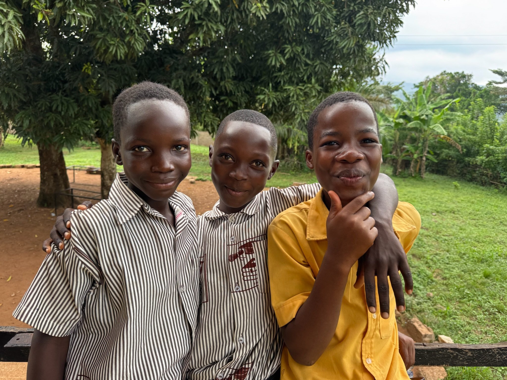 image of three young boys in ghana smiling