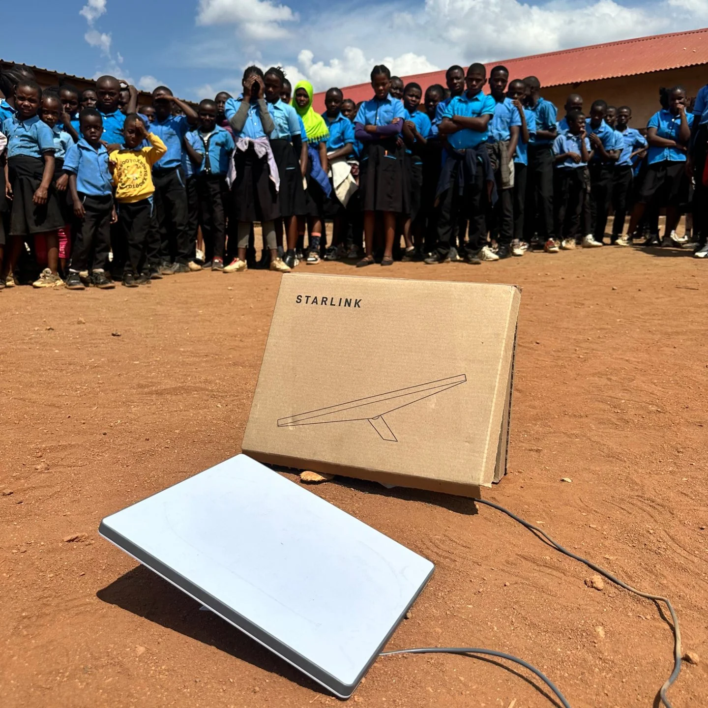 a starlink box and terminal sitting on the ground