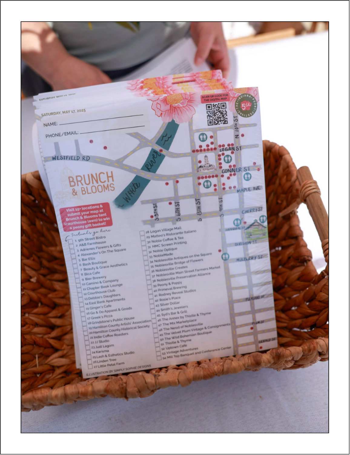 Brunch & Blooms event map for the Indiana Peony Festival featuring a hand-illustrated Noblesville downtown map with peony florals and local business stops.