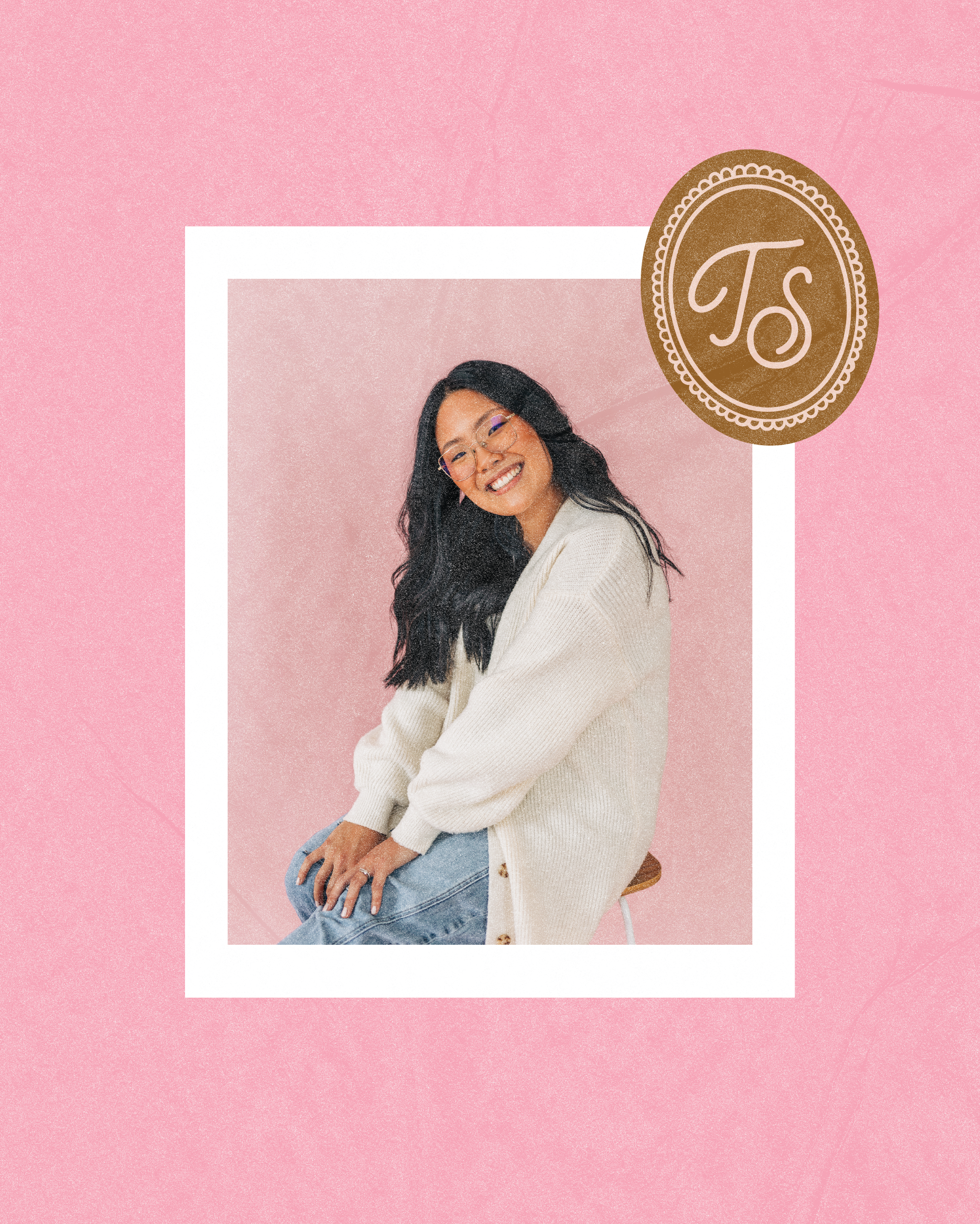 Tara Smiling woman with long dark hair wearing a cream sweater, seated against a soft pink textured background with a white frame overlay.