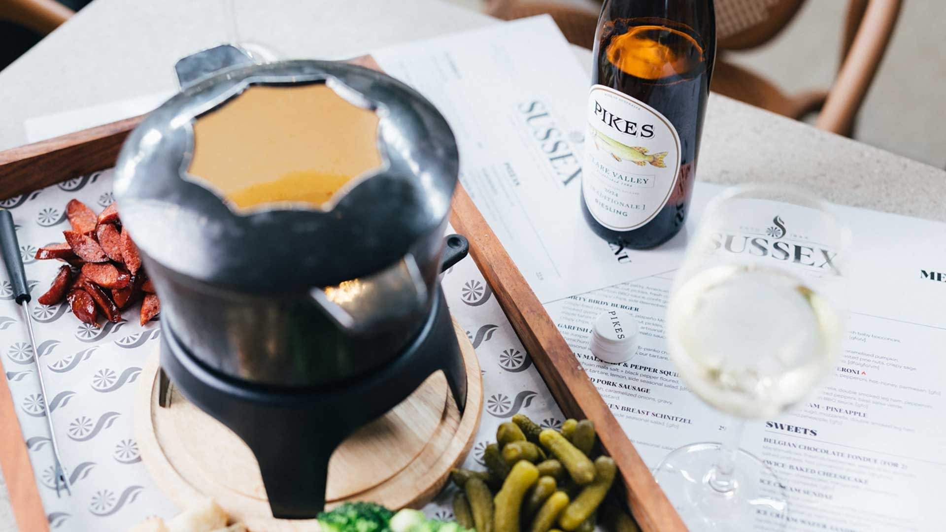 sussex savoury fondue with a bottle of riesling