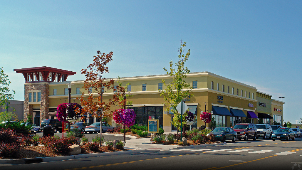 Daytime picture of shops and flowers at mall
