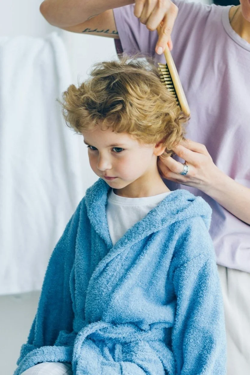 boy hair getting combed desensitized to haircuts