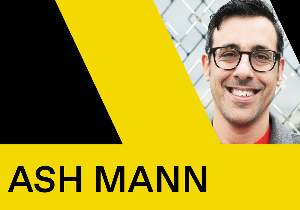 Portait image of Ash Mann with a black and yellow graphic