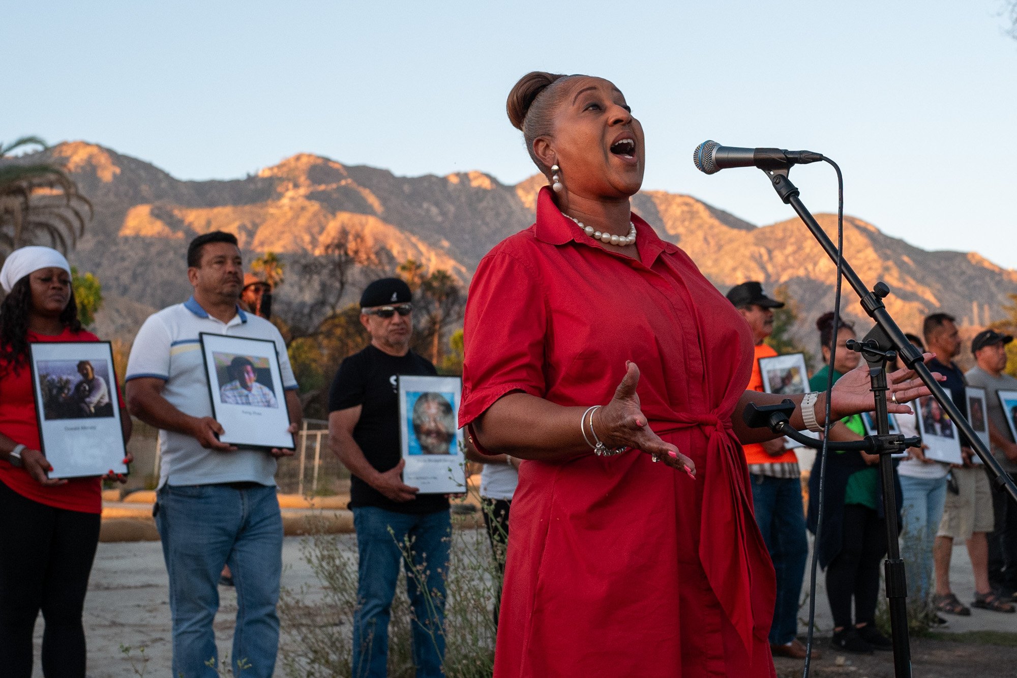 Altadena community members hold a vigil for the 18 people who passed away in the Eaton Fire on the six-month anniversary of the fire, Altadena, July 7, 2025.