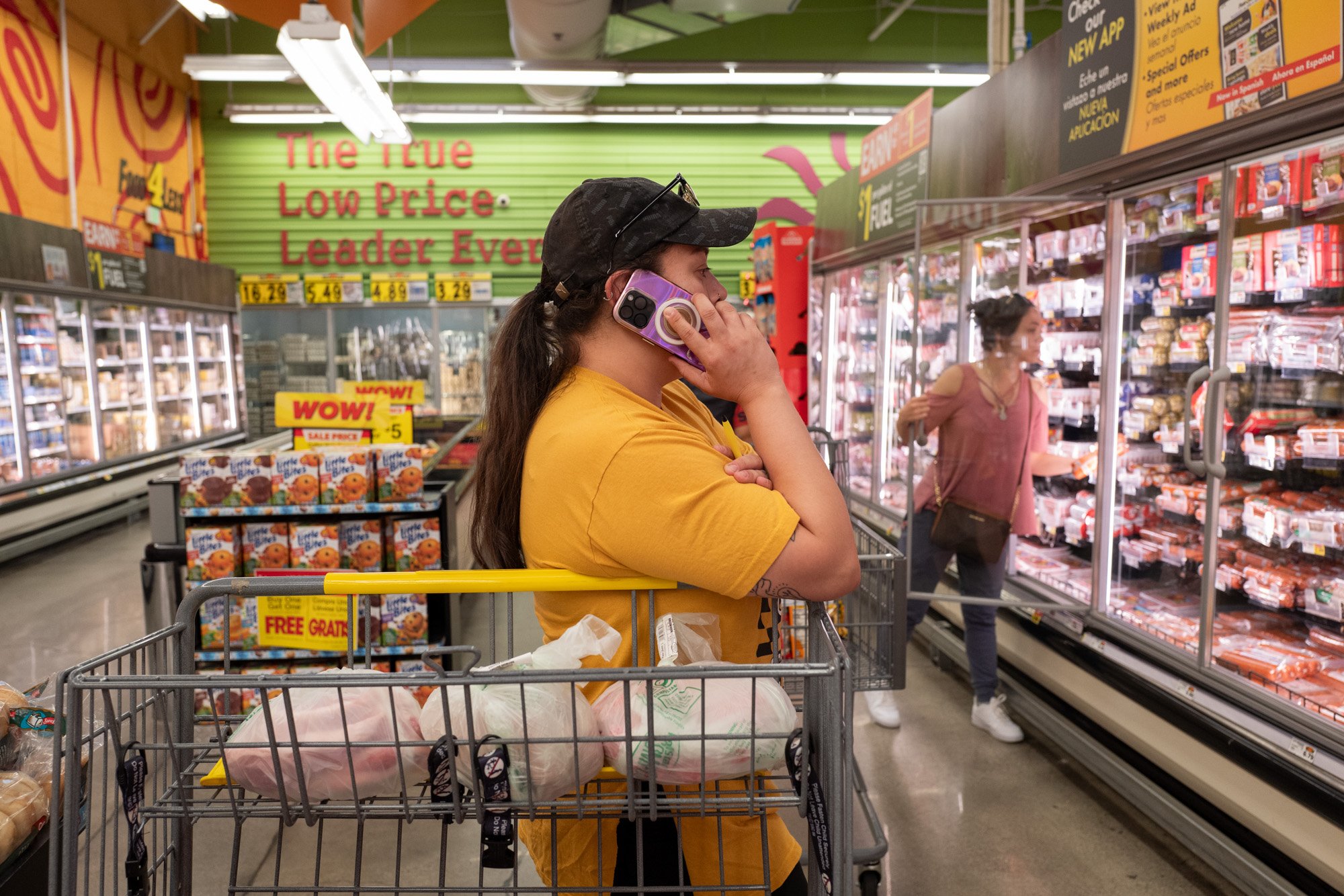 Roxana Arguelles calls a family to check which items they want her to purchase during an Amor Al Valle grocery shop for undocumented residents sheltering at home, July 1, 2025.