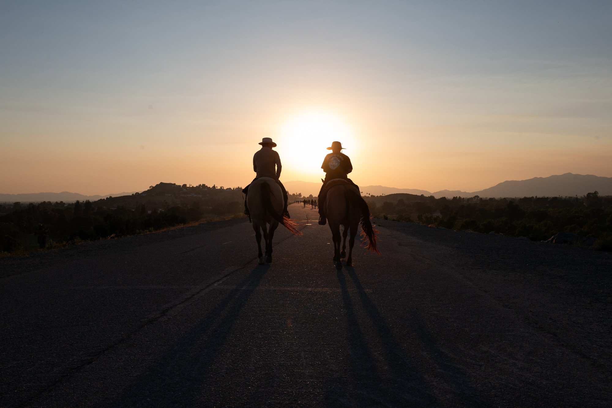 Vaqueros ride horses on Hansen Dam in Pacoima, July 3, 2025.