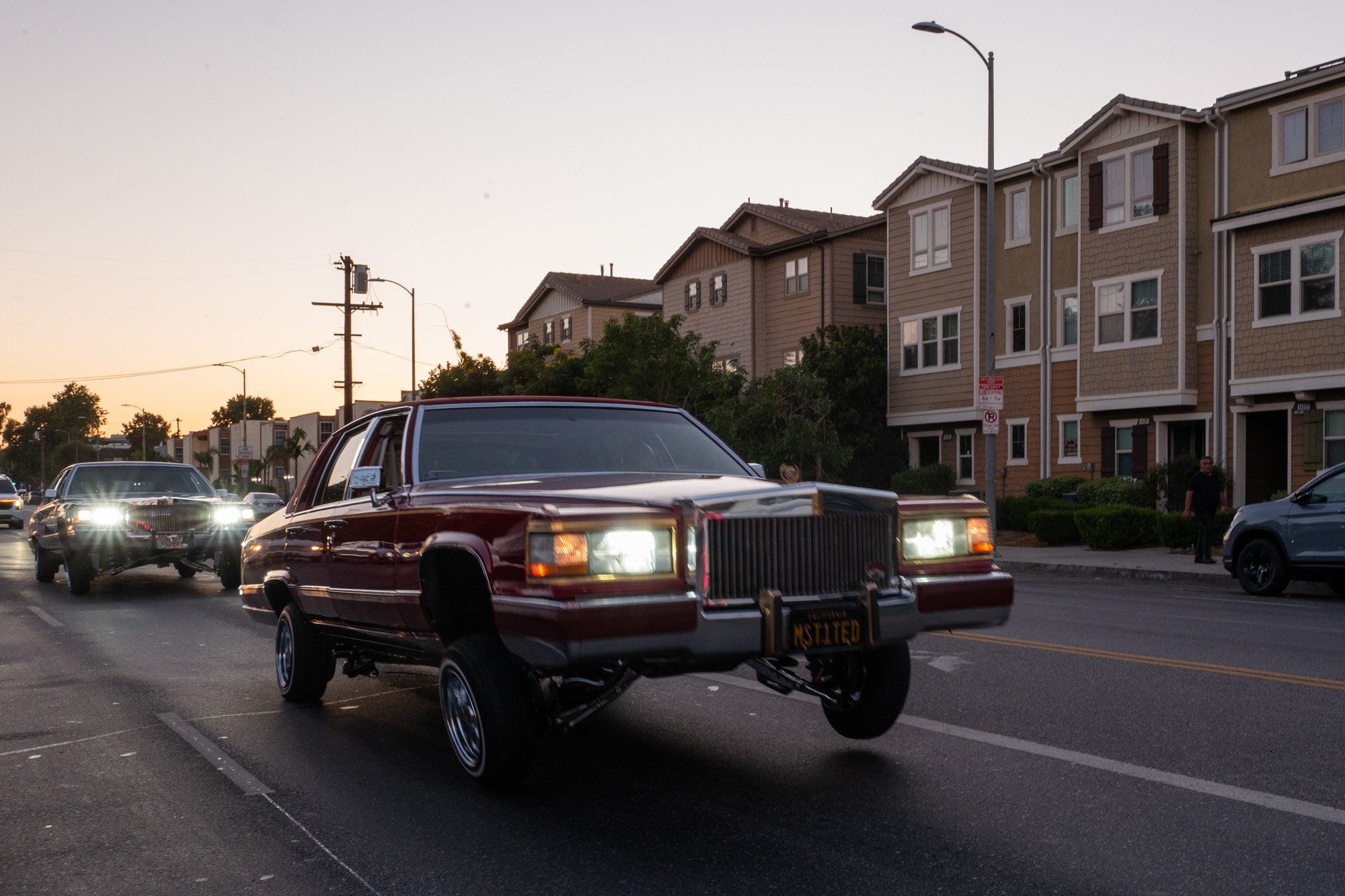 Lowriders cruise on Sherman Way in the San Fernando Valley, July 6, 2025.