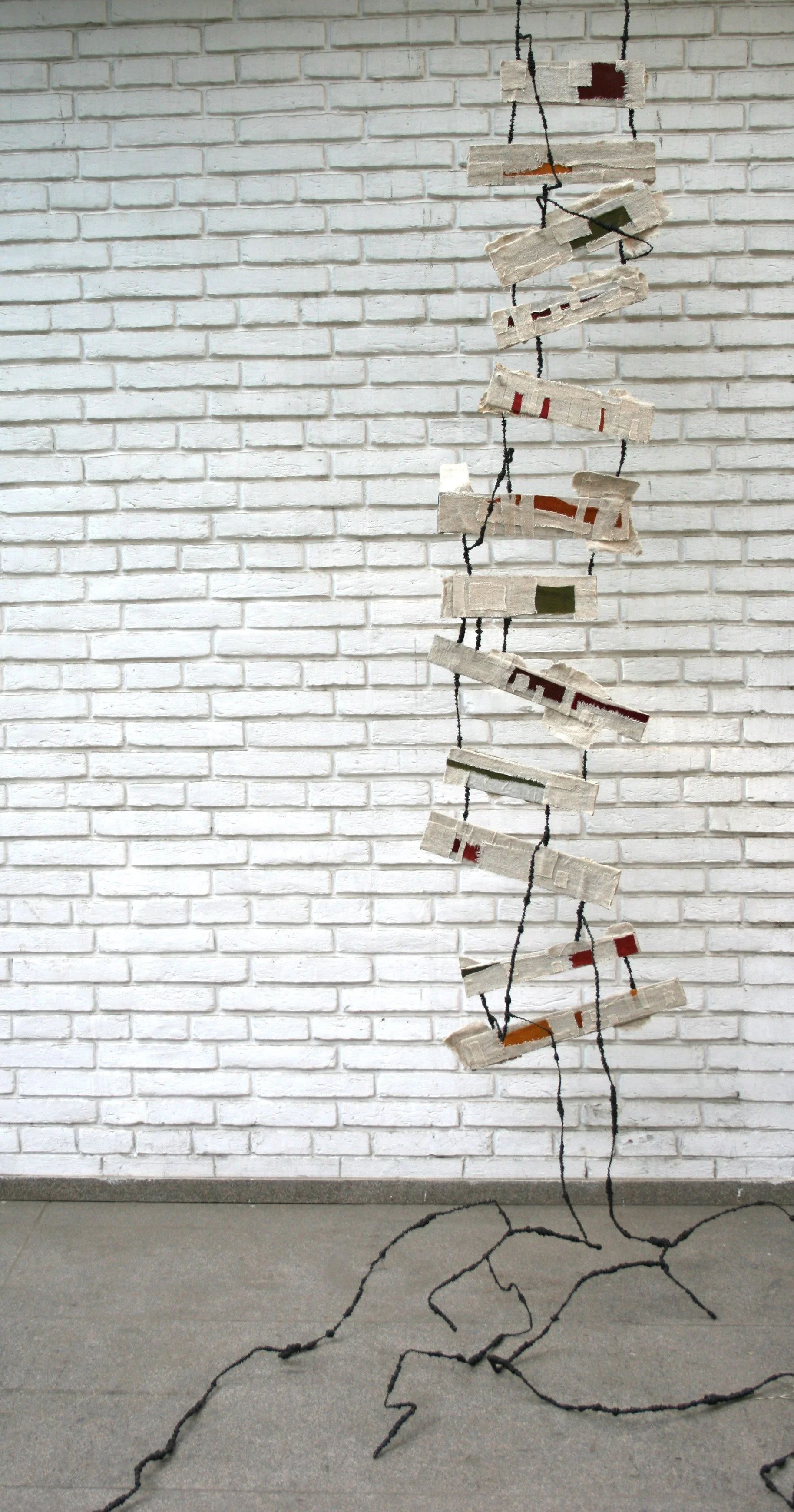 “Navigating Pathways”,
Pen & Ink, Acrylic, paper, fabric & wire,
18” x 92”, 2011