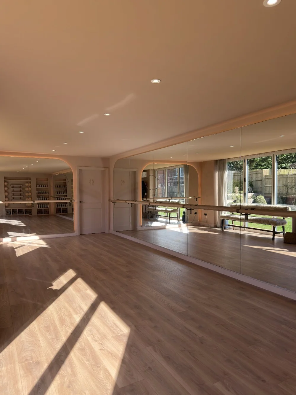 The Barre Coach studio in Cobham with mirrors, barres and sunlight on the floor