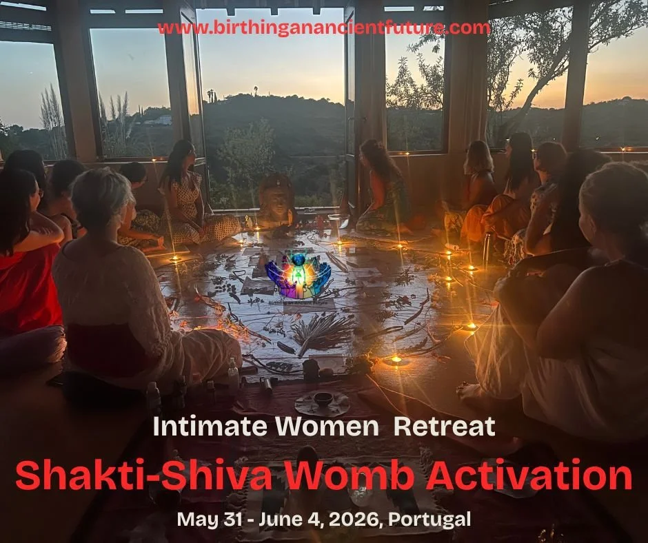 Women sitting in a circle inside a room with large windows overlooking a sunset landscape, participating in a spiritual retreat for womb activation. The scene has warm lighting, candles, and a digitally edited central figure representing energy or divine presence. Text overlays advertise the event: 'Intimate Women Retreat, Shakti-Shiva Womb Activation, May 31 - June 4, 2026, Portugal'.