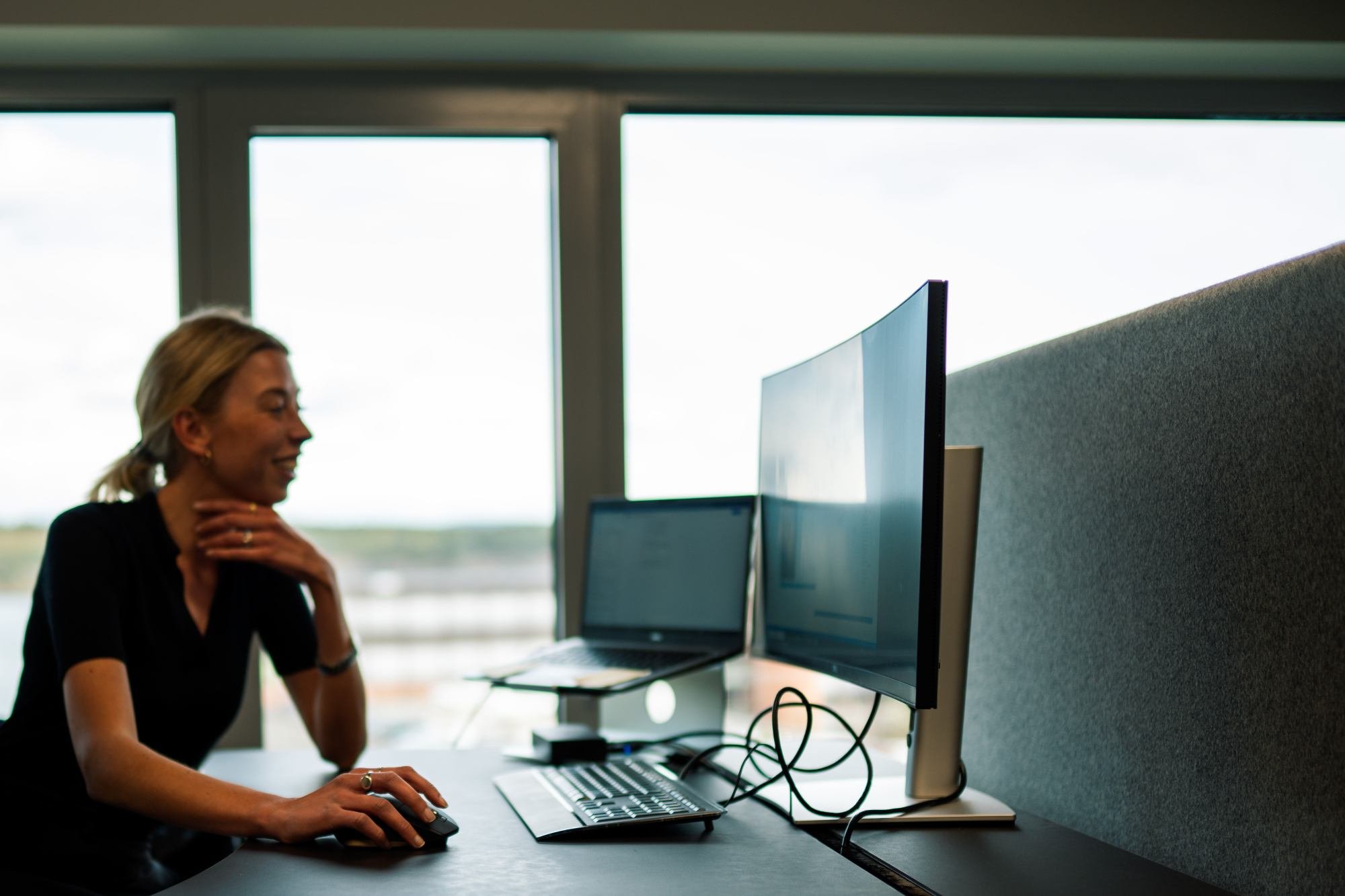 Genus employee working sitting in front of a screen