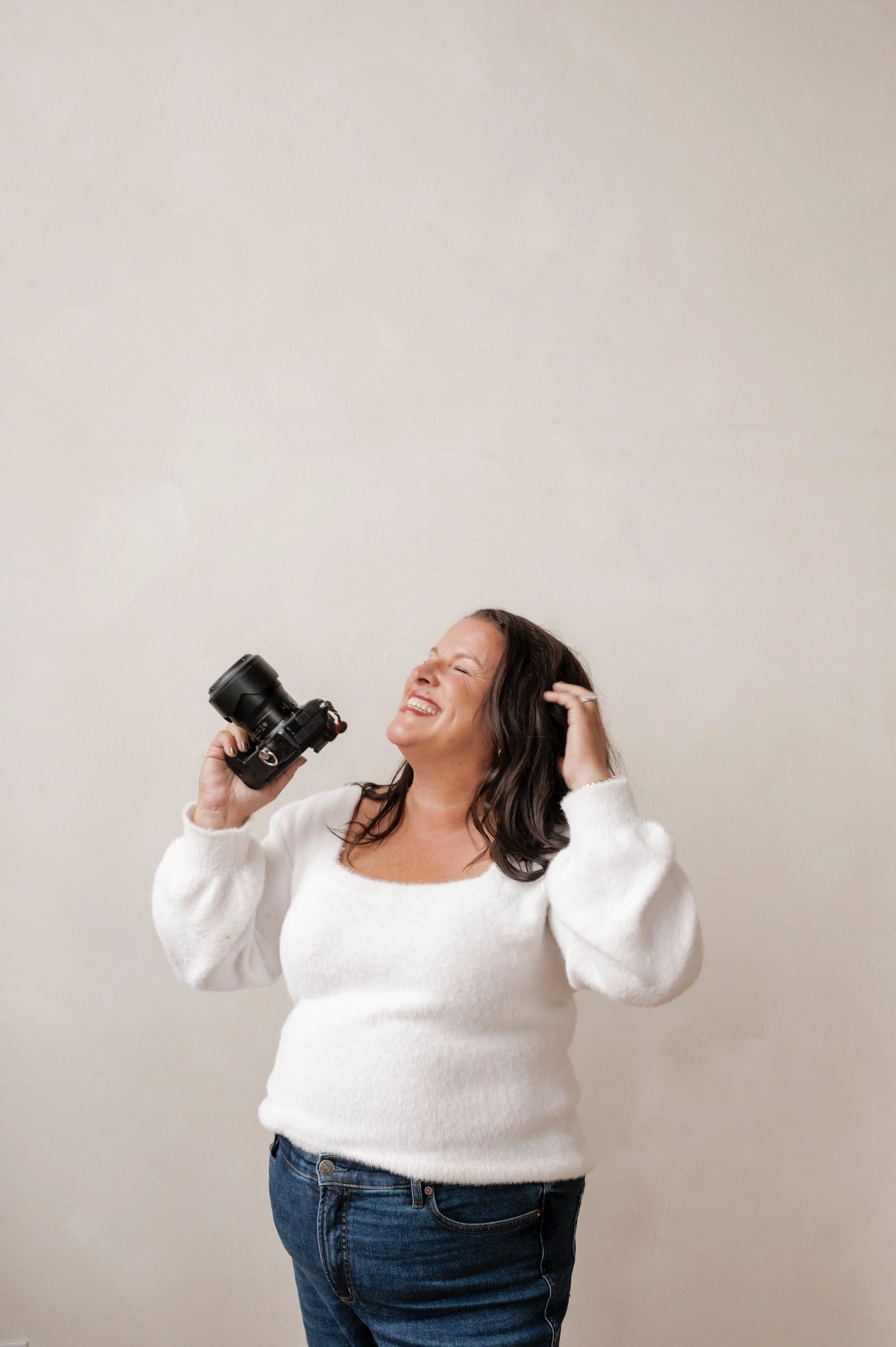 Brand Photographer with camera.