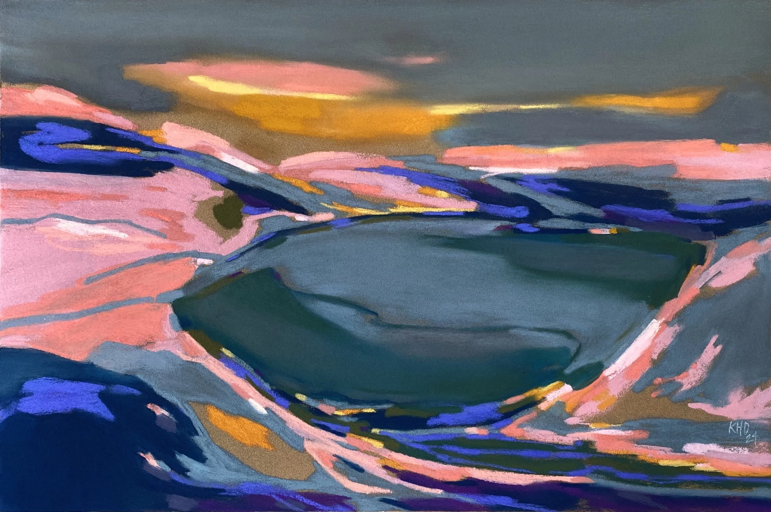 A Still lake Beneath Glowing Hills