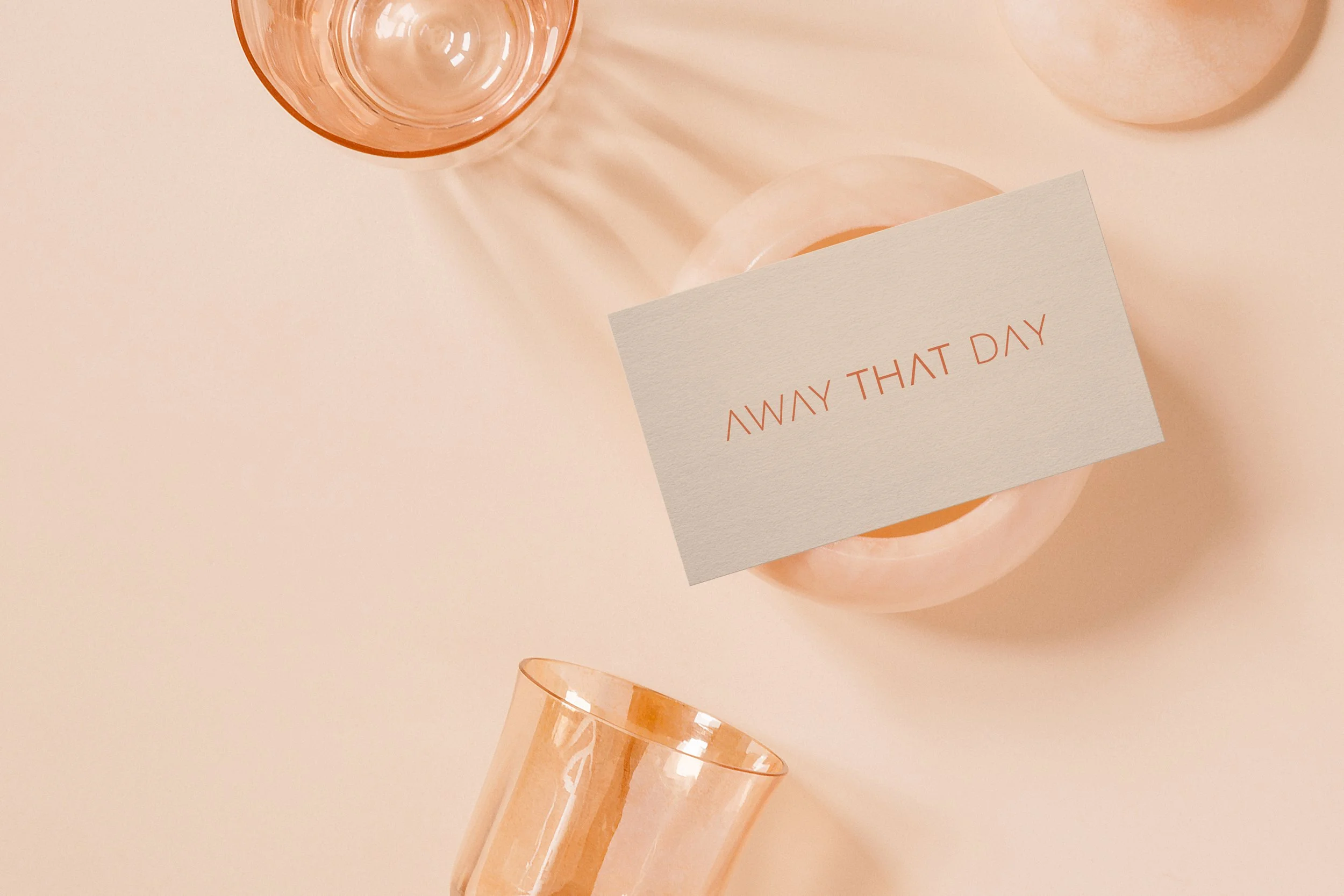 Away That Day brand identity applied to printed customer touchpoints