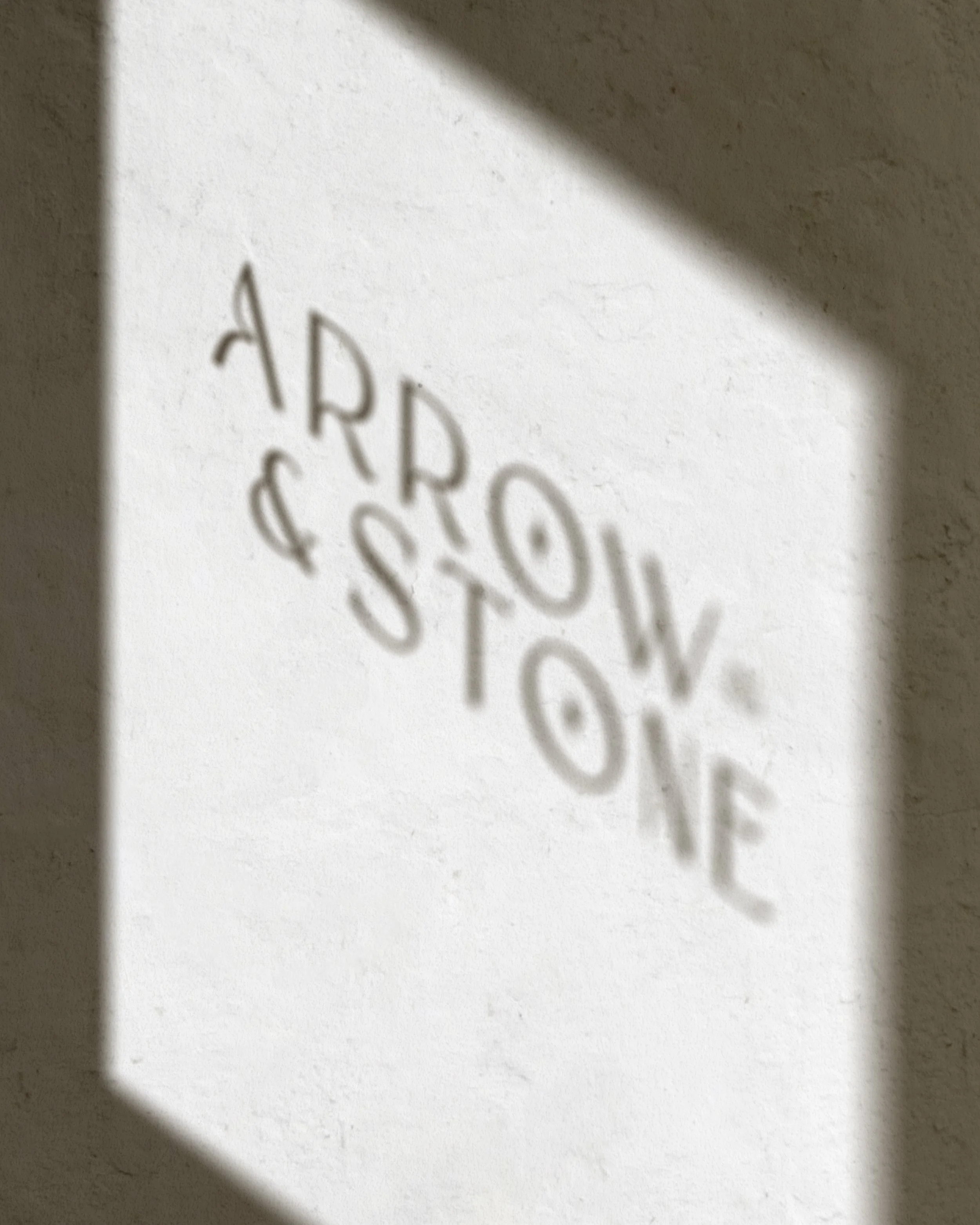 Arrow & Stone brand identity refinement showing the logo used within the wider visual system