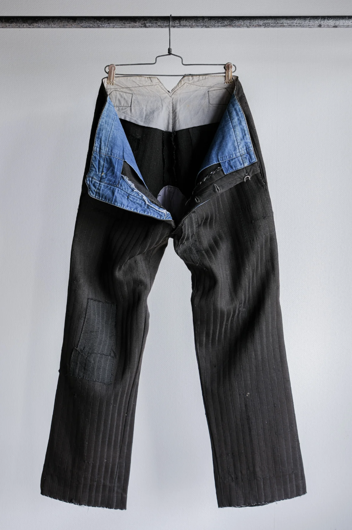1920s wool trousers with denim pocketing.png