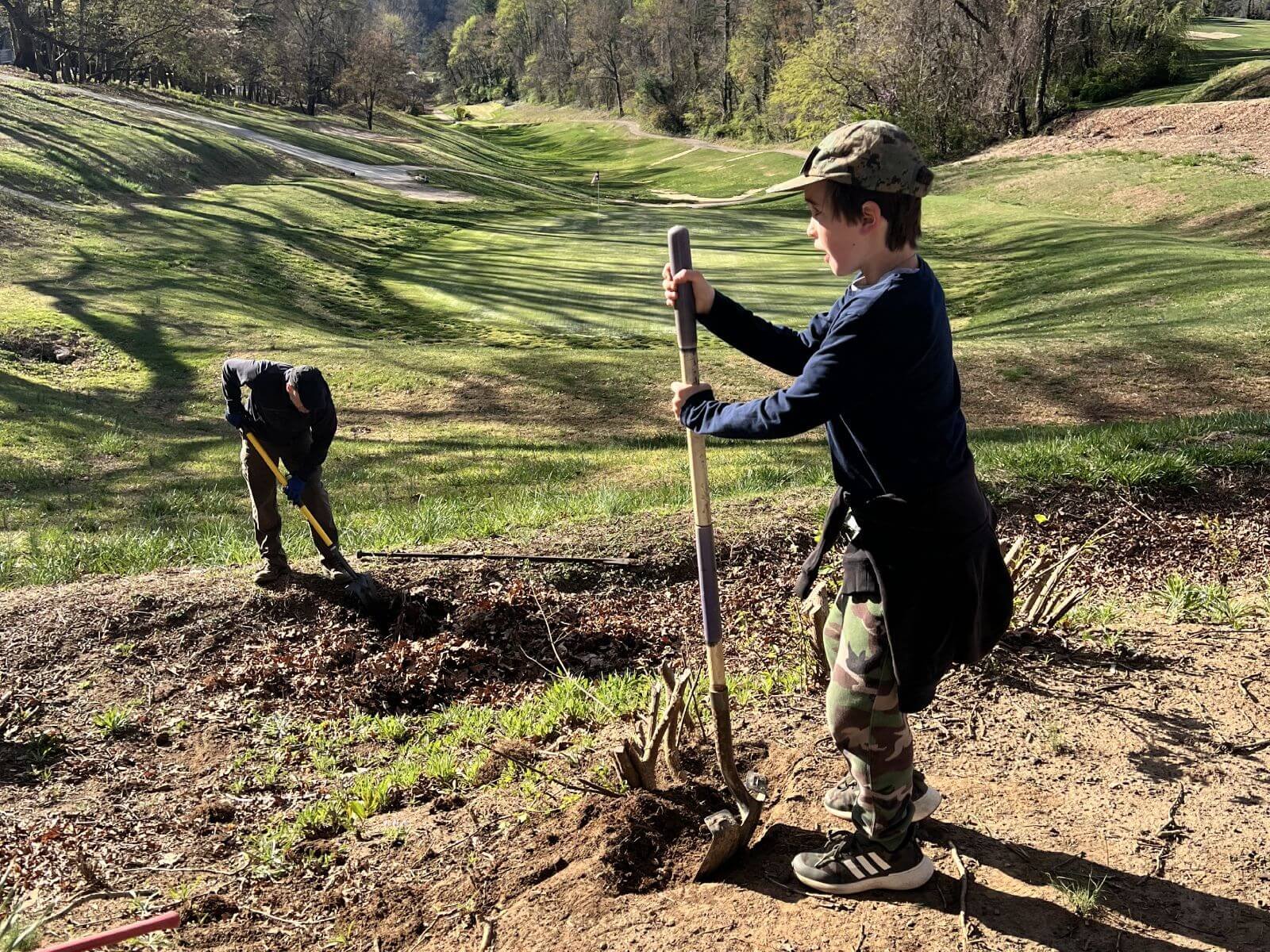 photo of youth volunteer at asheville muni golf course.jpg