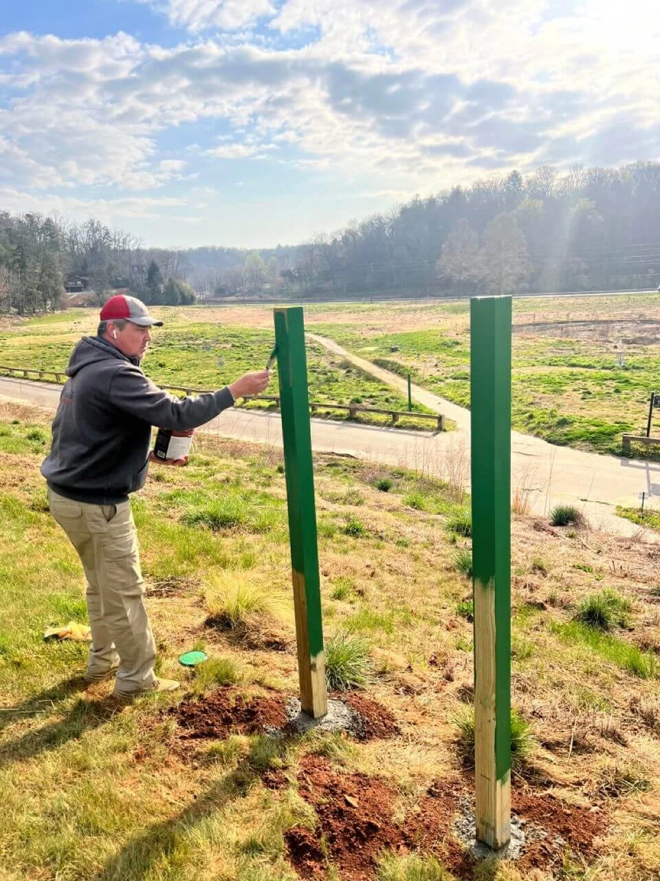 photo of painting new sign at asheville muni.jpg
