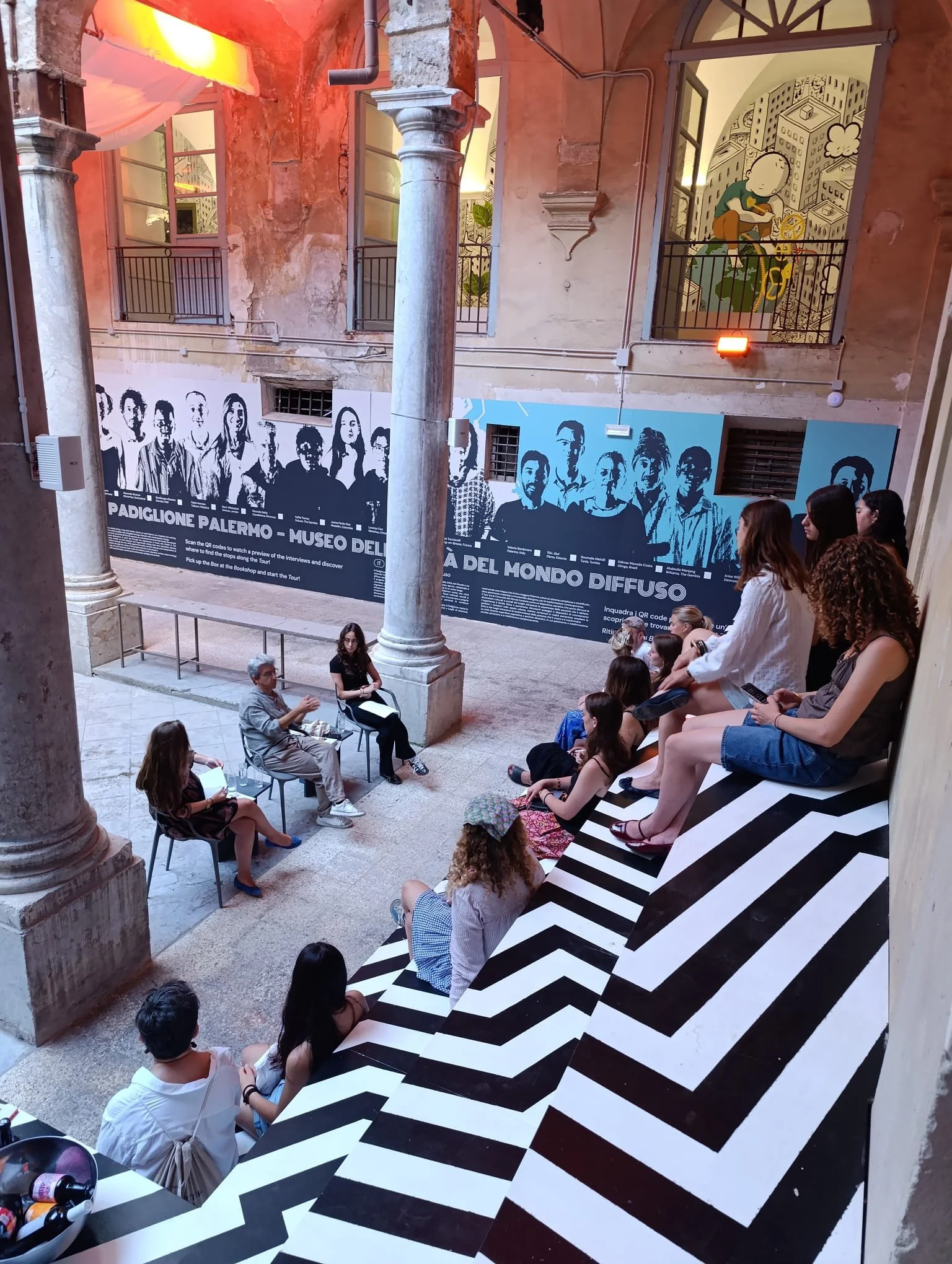View of the Museum of the Cities of the World’s cloister featuring Motorefisico’s artistic grandstand installation.