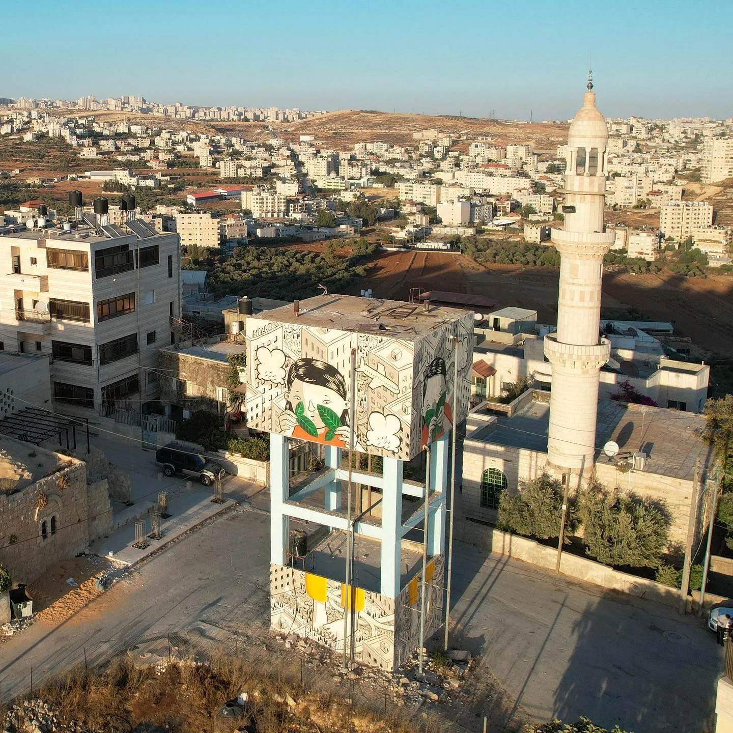 Millo’s mural “The Mulberry Tree,” created in Al Jib, Palestine, in 2023.