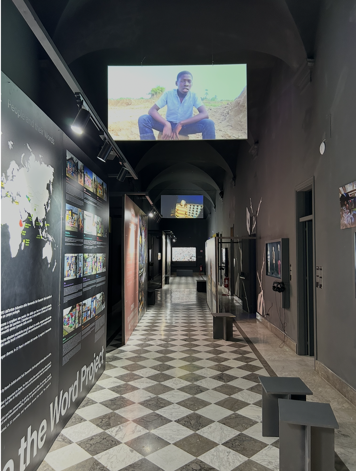 Exhibition and research corridor of the Countless Cities Knowledge Center, with urban projects displayed along the walls.