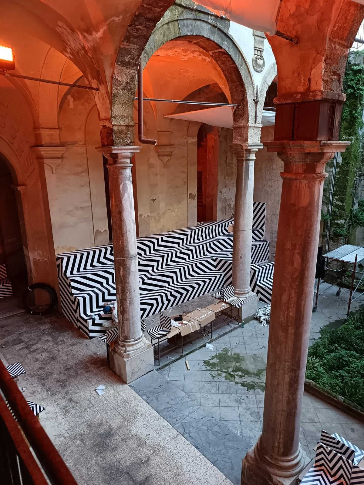 Motorefisico’s black-and-white artistic grandstand in the cloister of the Museum of the Cities of the World in Palermo.