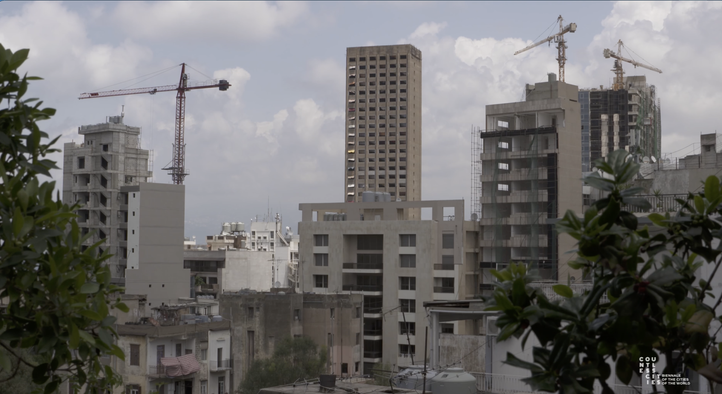 Beirut’s urban skyline, with residential buildings, high-rise construction and cranes rising across the city.