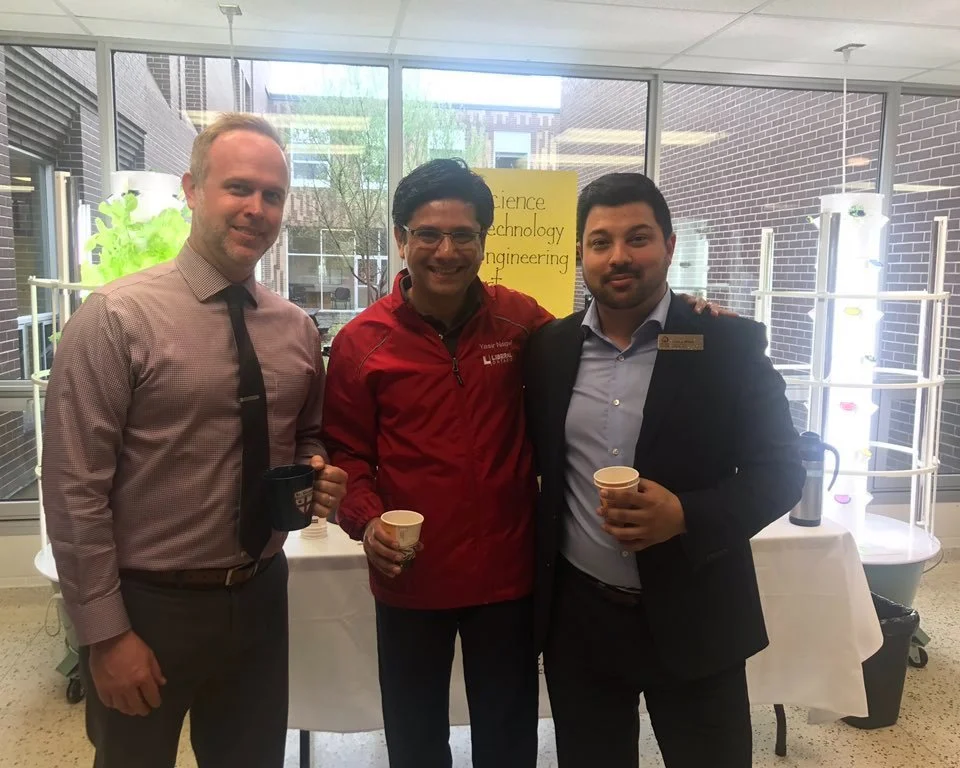 Jeremy wittet drinks coffee with two men