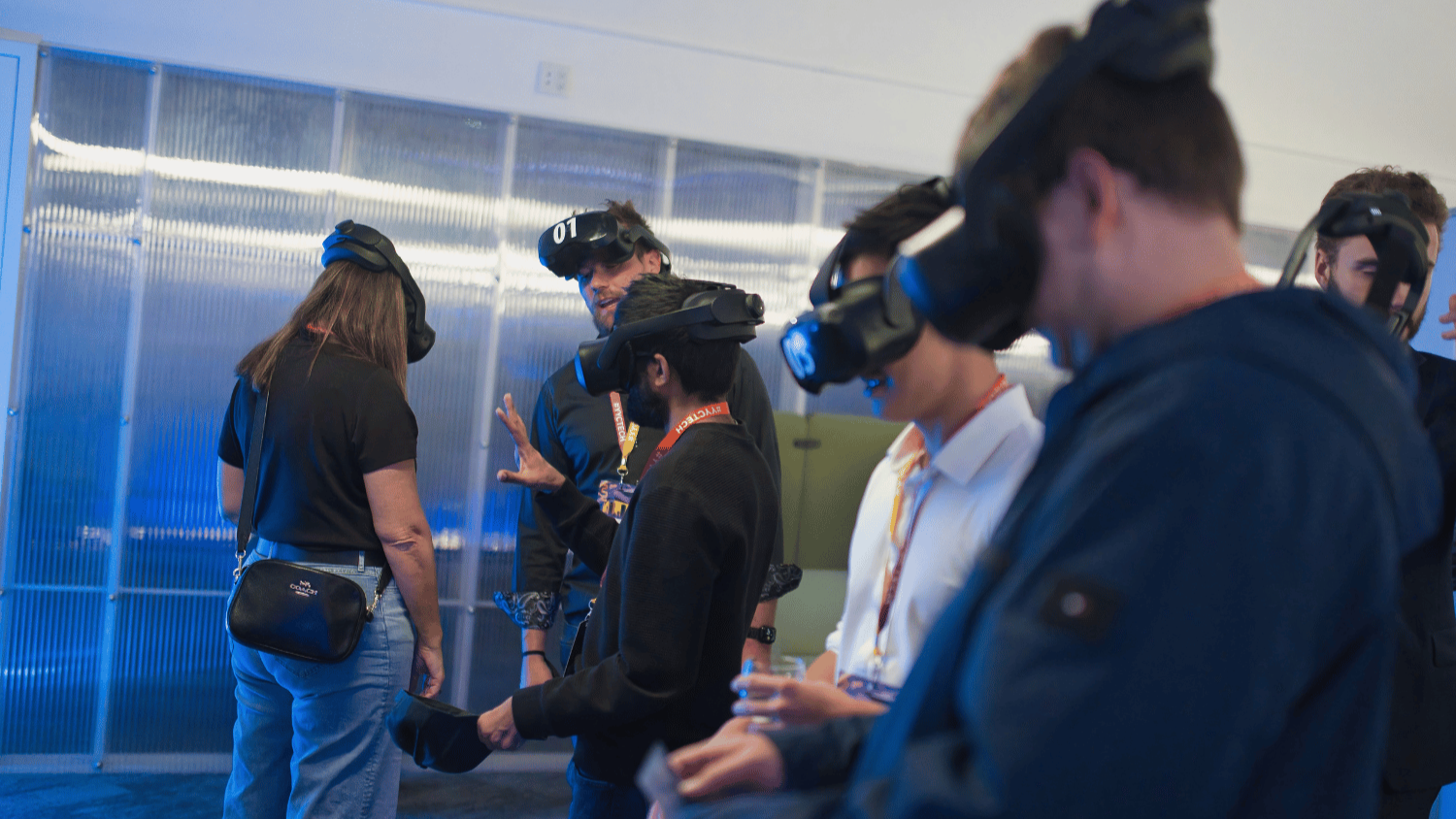 people trying on virtual reality headsets