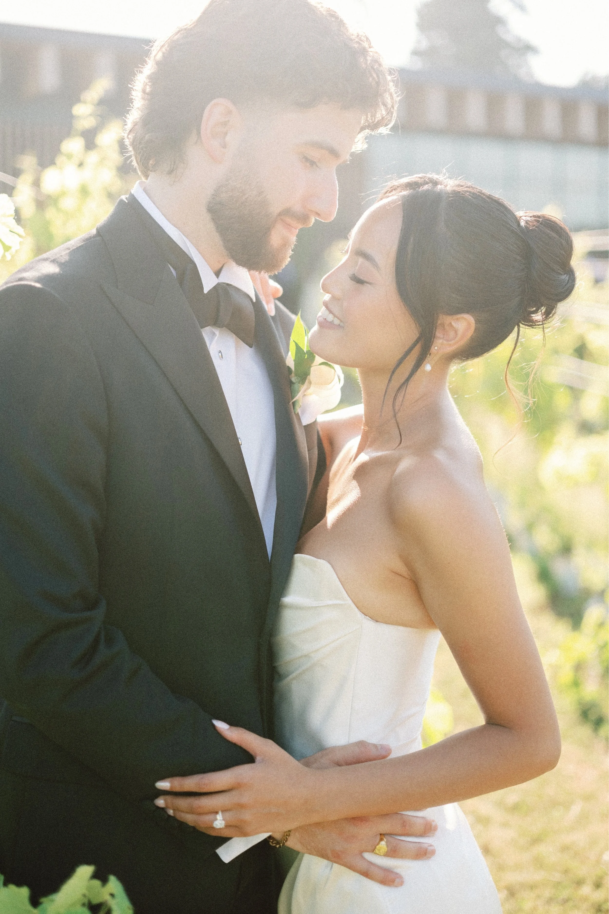 Sleek updo with face framing bangs