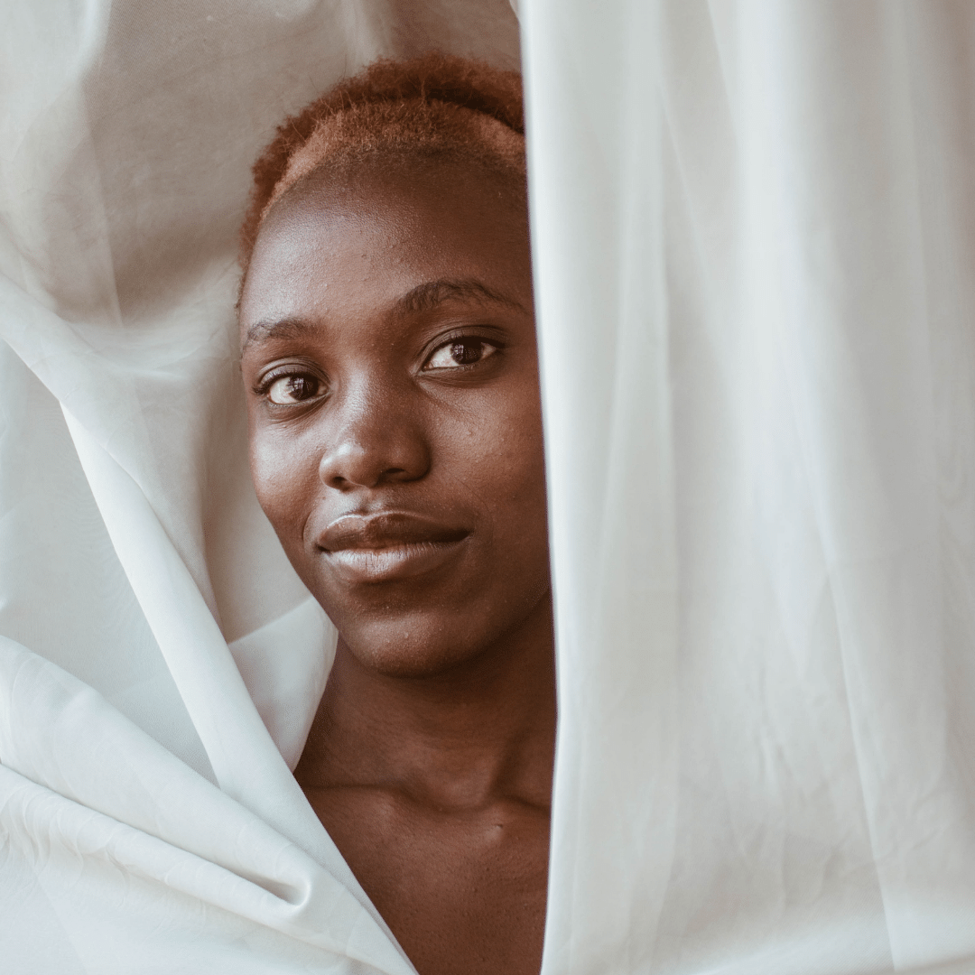 A black woman smiling at the camera