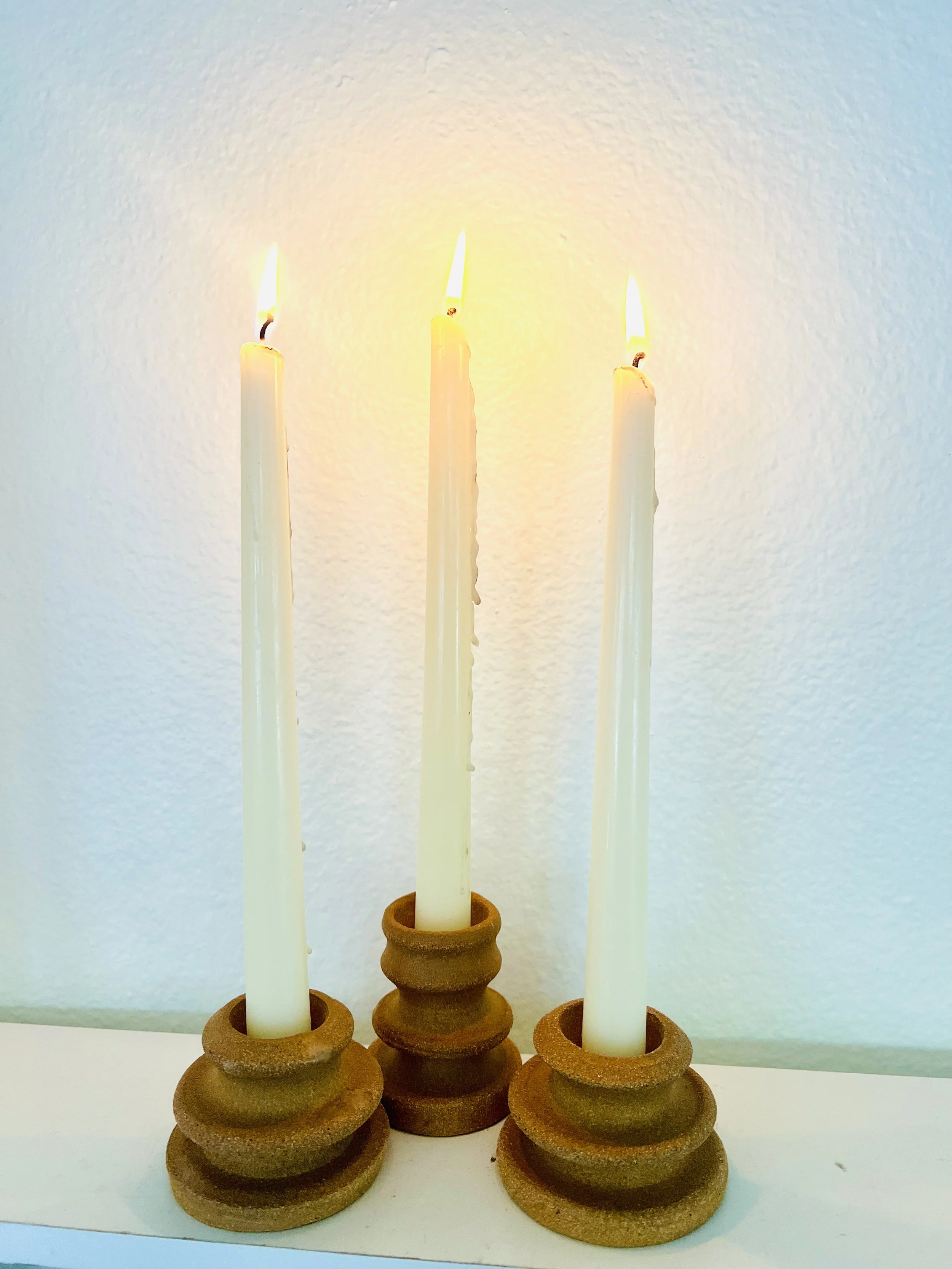 Pair of terra brown candlestick holders
