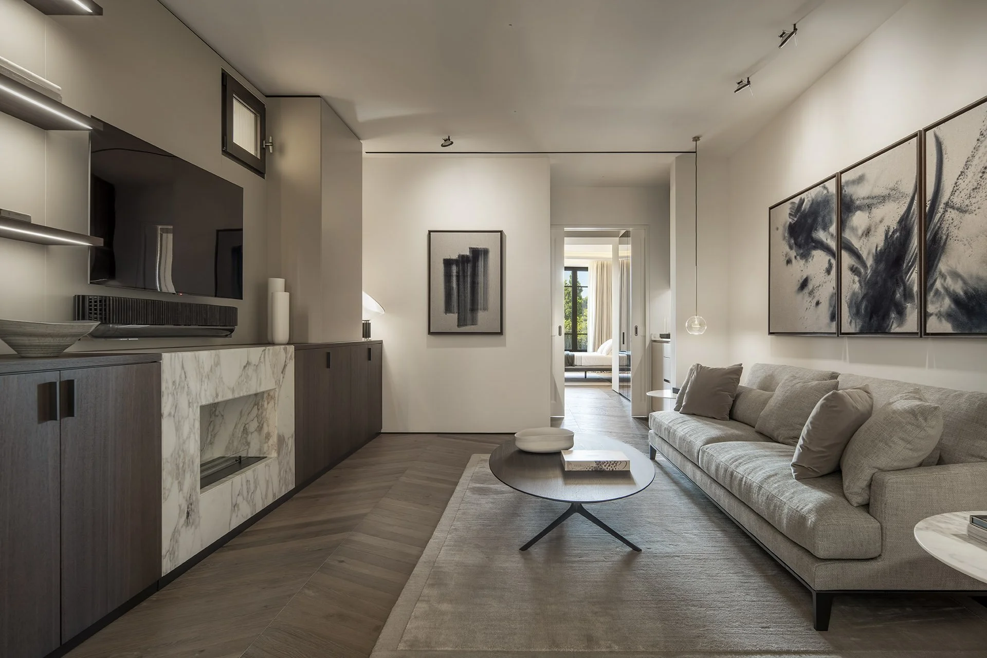 First-floor sitting room with fireplace and artwork at Villa Calatrava