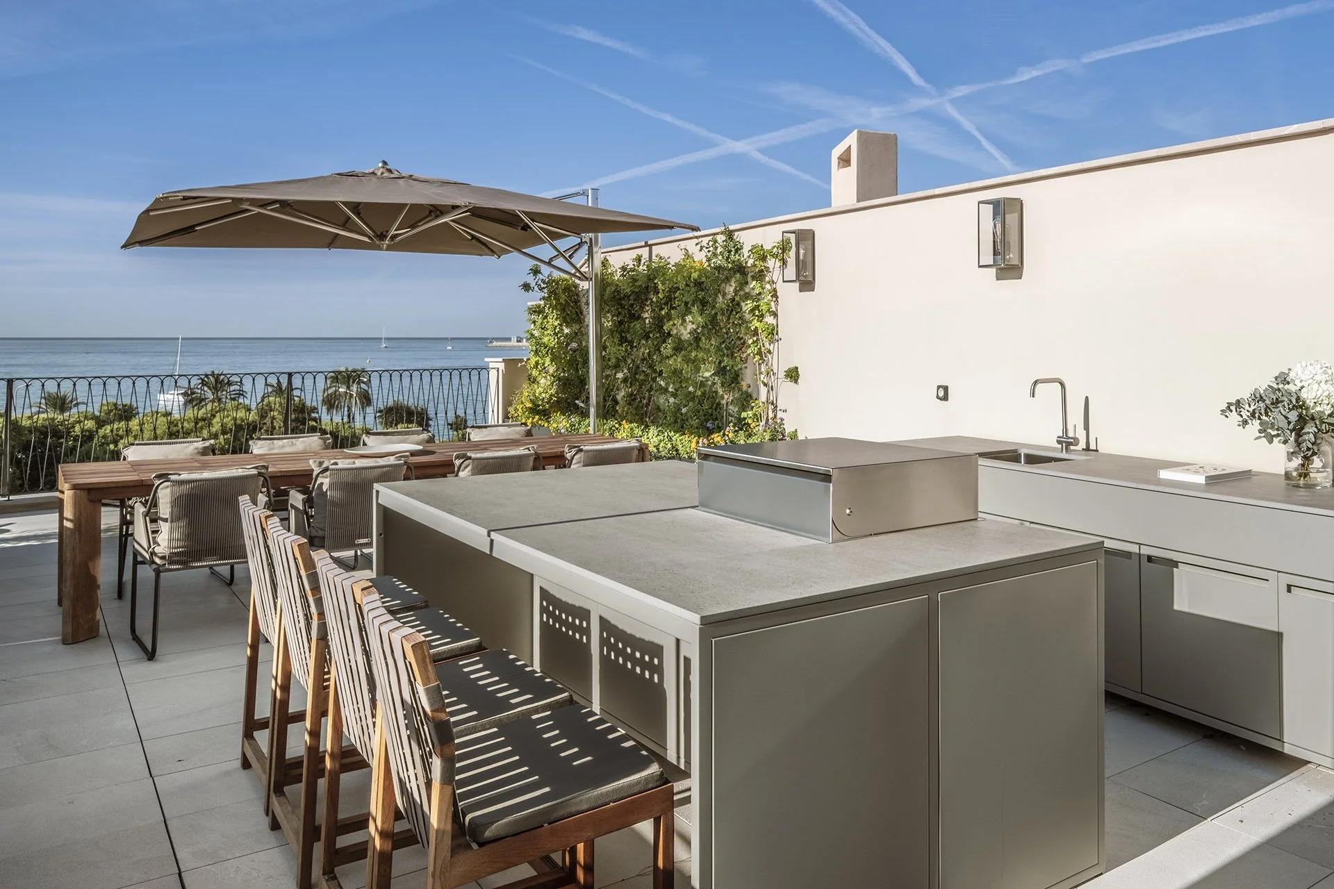 Outdoor kitchen and dining area on Villa Calatrava’s rooftop terrace