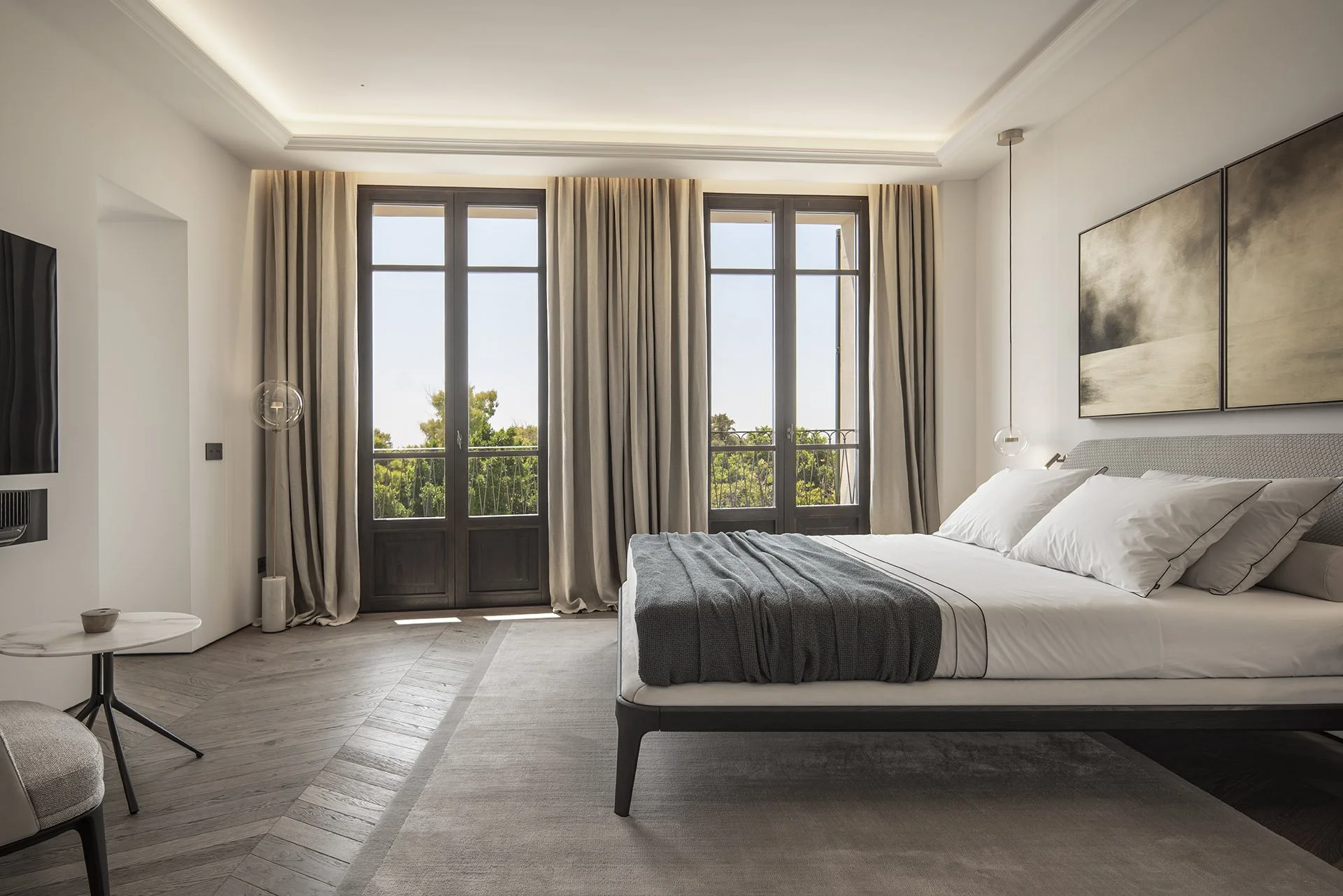 Owner’s bedroom with tall windows and natural light at Villa Calatrava