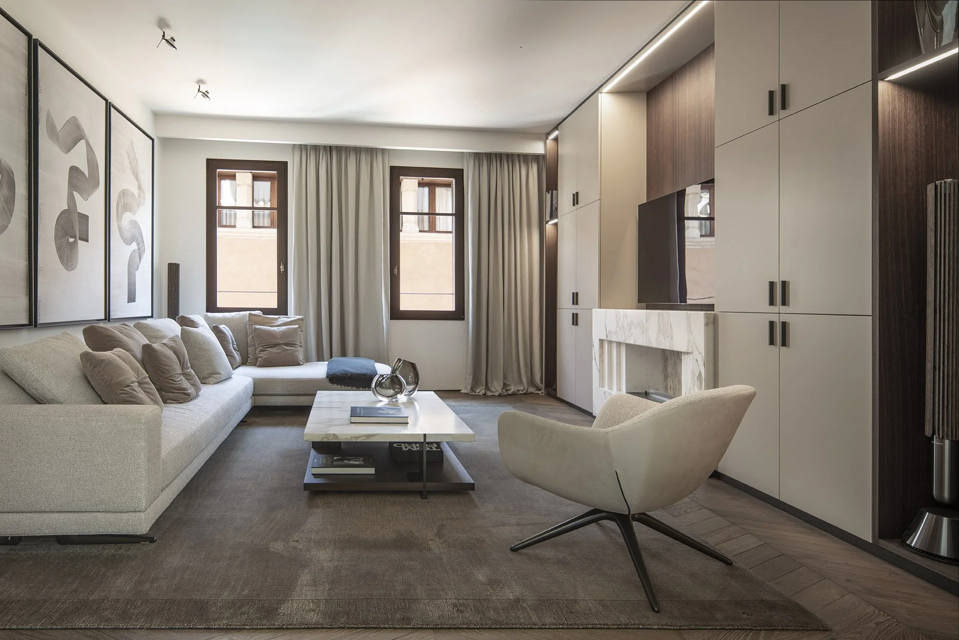 Private sitting room with fireplace and bespoke cabinetry at Villa Calatrava