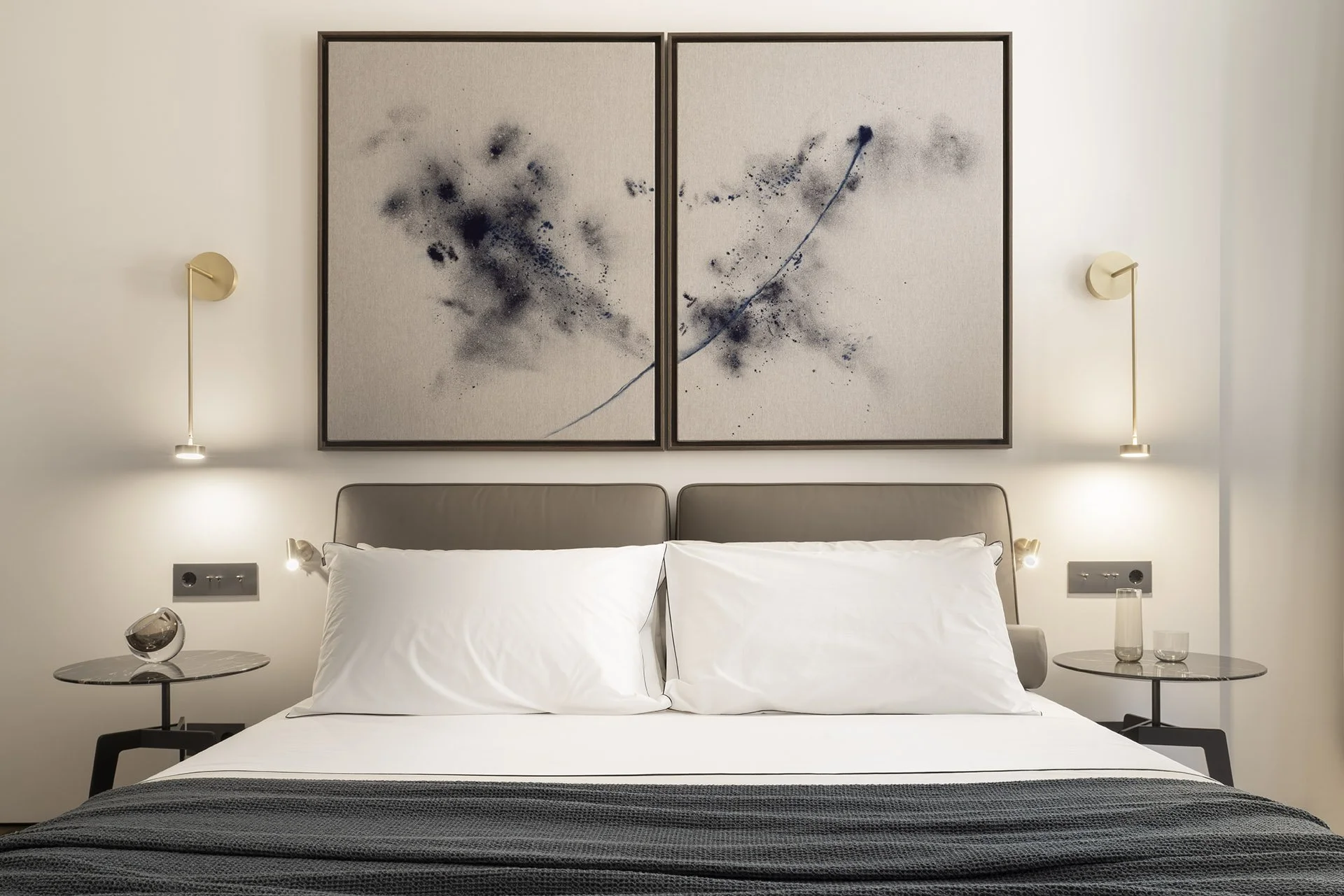 Guest bedroom with paired artworks above the bed at Villa Calatrava
