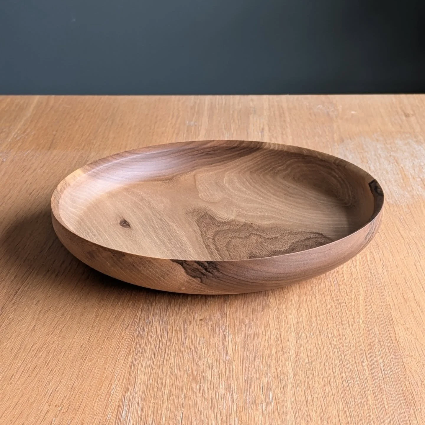 Easing back into the lathe after a couple of weeks off with this shallow walnut bowl. 26cm across, with a simple form and lovely grain &mdash; a good way to get the hands moving again.

Finished with @natashacraig_woodworker wood wax, which gives a s