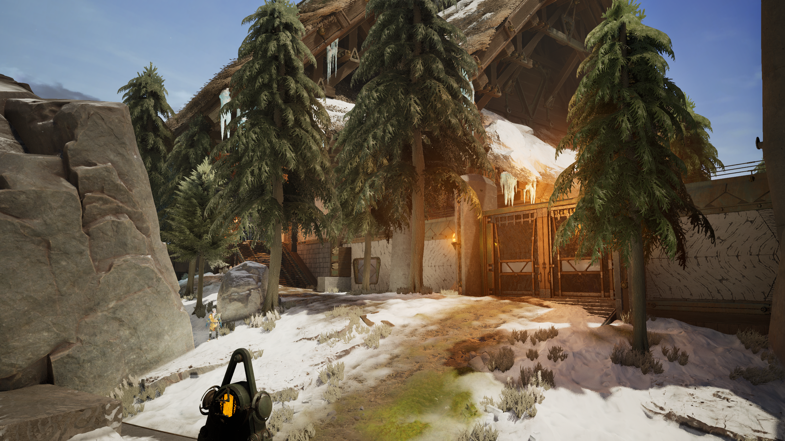 A snowy outdoor scene with tall pine trees, large rocks, and a wooden entrance gate to a building that has icicles hanging from the roof, with sunlight illuminating the area.