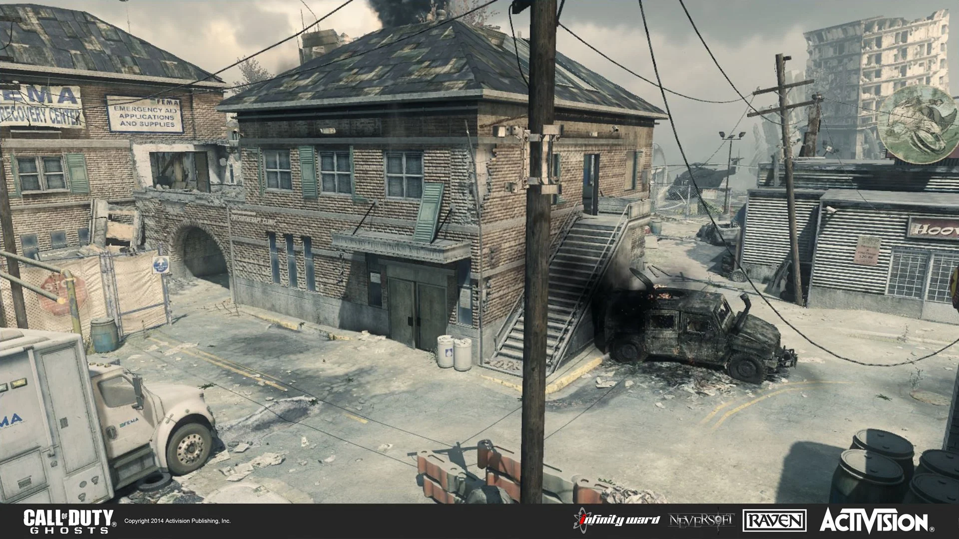 A war-torn urban scene with damaged buildings, a burned-out vehicle on the street, and emergency vehicles in the vicinity.