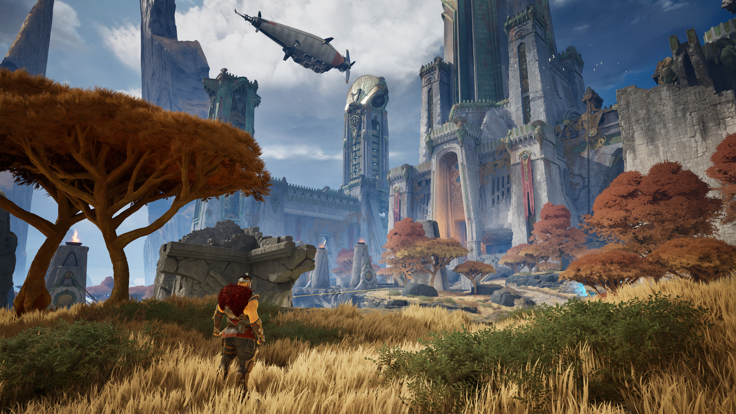 A fantasy scene with a character walking through a grassy field with autumn trees, leading to a grand castle with tall spires and flying ships in the sky.