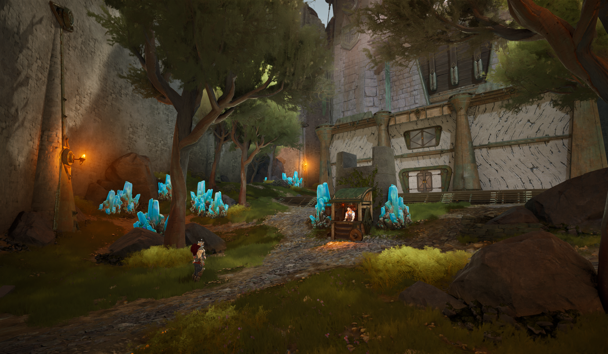 A fantasy scene featuring a dirt pathway lined with large rocks and glowing blue crystals, flanked by tall trees with twisted branches and moss. To the right, there is a large stone and metal building with pillars and pipes, illuminated by warm lante