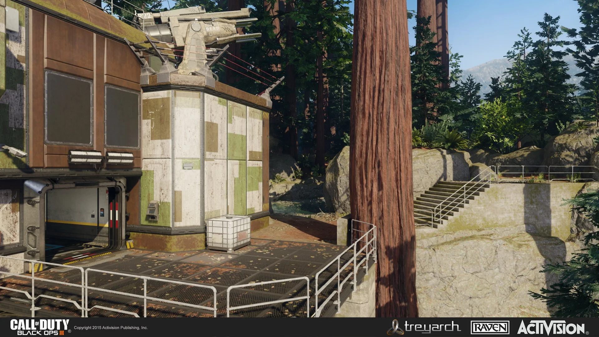 A military-style building with a helicopter on top, surrounded by trees and rocks, with stairs and handrails nearby in a forest setting.