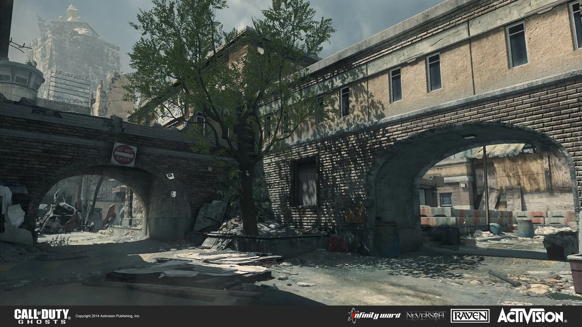 Post-apocalyptic urban scene with wrecked cars and debris under an archway, graffiti on walls, and a large tree growing amidst ruined buildings.